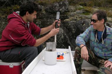 Scientists taking a sediment core for mercury analysis