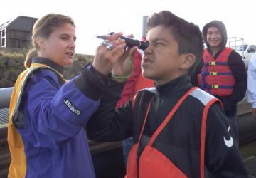 volunteer taking environmental data