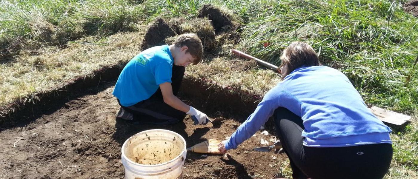 volunteers excavate plot