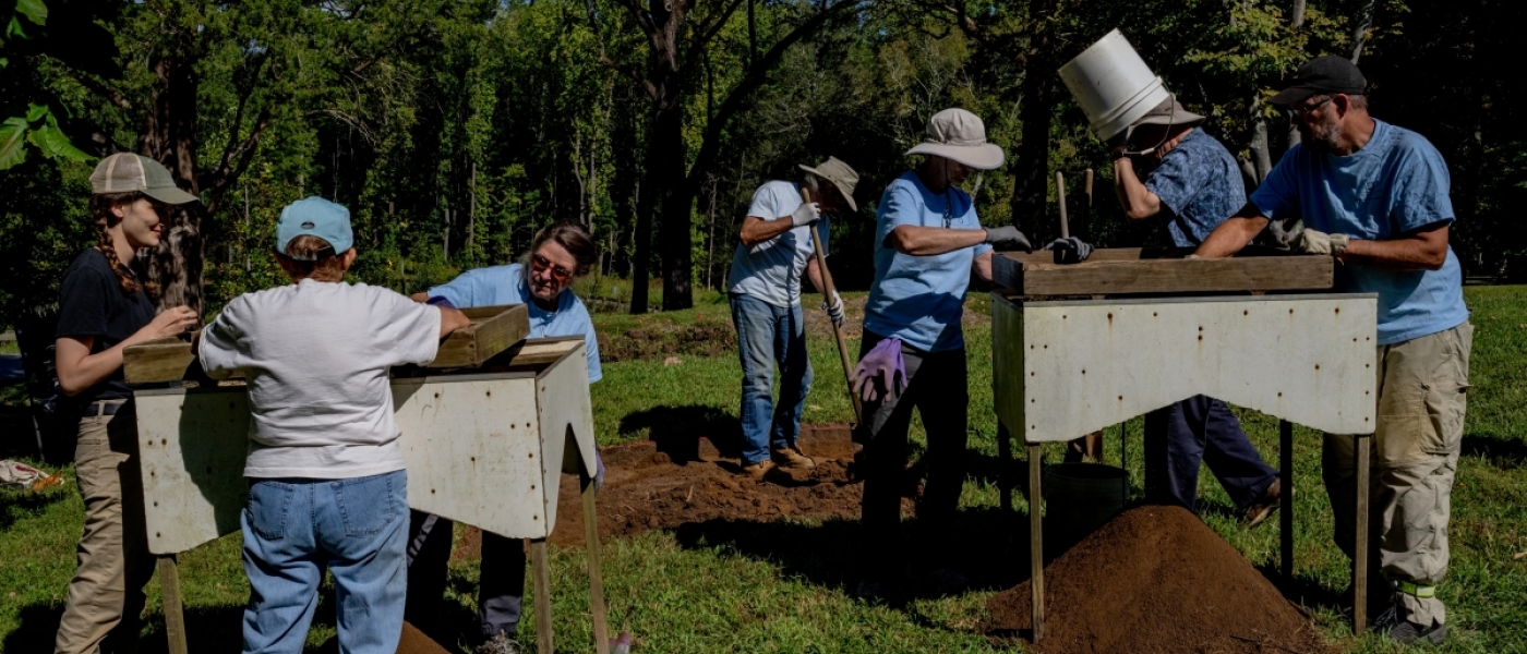 A group of people working at an archaeological site