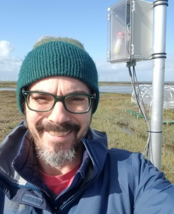 Profile picture of Roy Rich wearing glasses, a green beanie, and a blue jacket